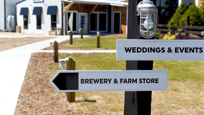 A sign points the way to Stable Craft Brewing and farm store, located at Heritage Hill Farm and Stables on Madrid Road in Augusta County on Thursday, April 14, 2016.