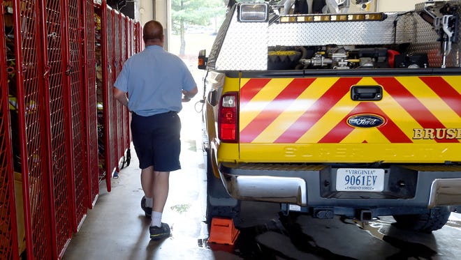 Terry Kelley, Augusta County supervisor and volunteer with Augusta County Fire Department's Company 10, heads to a brush truck to determine potential response times, if the Richmond Road station were to close, on Tuesday, July 18, 2017. He plans to use the truck while timing how long it takes to drive five miles along specific routes between Company 10 in Staunton, Company 11 in Fishersville and SwoopeÕs Company 14.