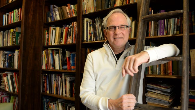 Arketype Inc. founder and owner Paul Meinke, pictured inside the firm's library, has returned to the advertising agency he founded after a kidney transplant March 31.