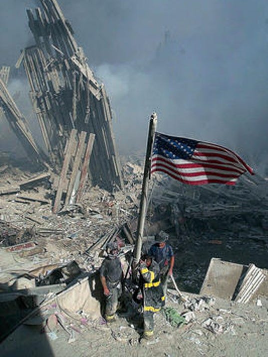 9/11 anniversary Flag raised at ground zero in iconic image found