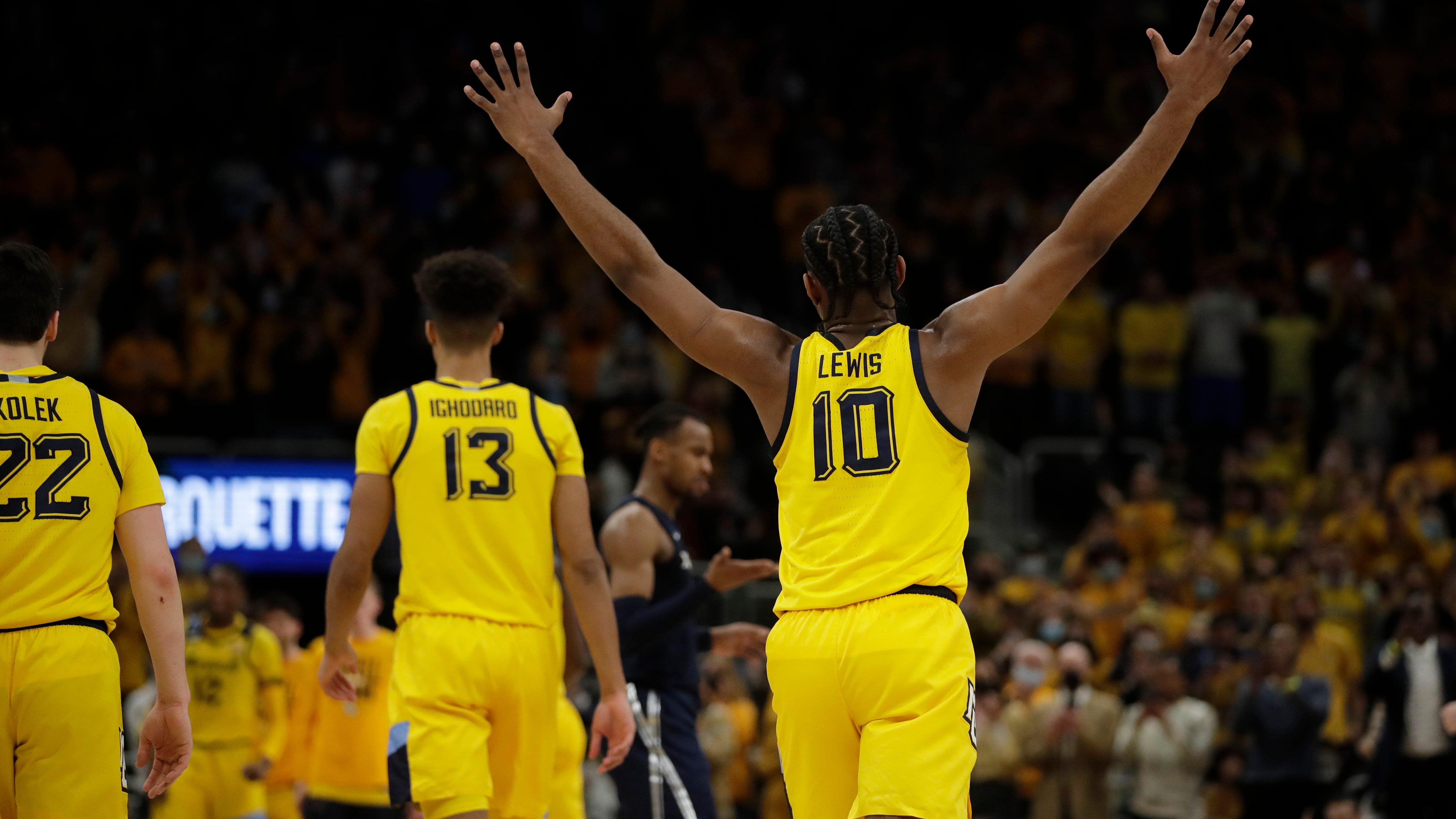 Marquette's Justin Lewis (10) reacts during the second half of an NCAA college basketball game against Xavier Sunday, Jan. 23, 2022, in Milwaukee. (AP Photo/Aaron Gash)