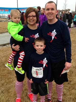 The Devereaux family - Jace, Jessica, Noah and Chad (left to right) - ran together at the March 21 Run for the House. Noah ran the kids' mile, and Jessica and Chad pushed the two boys in a stroller during the 5K. "We try to set an example for our boys," Jessica said. "We've been doing this (as a family) for a lot of years."