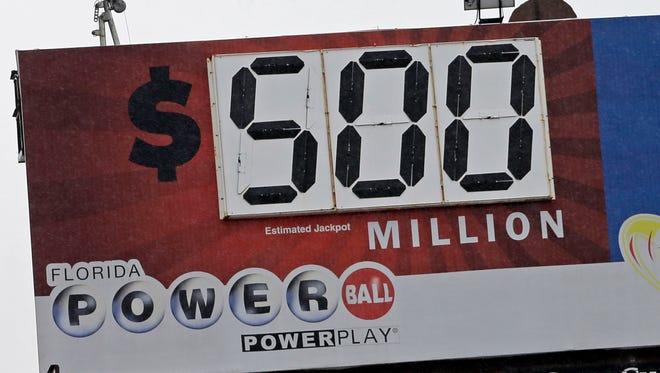 A billboard displays the estimated jackpot for the Powerball lottery, Wednesday, Jan. 6, 2016, in Miami. The estimated Powerball jackpot for Wednesday night has soared to $500 million. The last time Powerball had grown this large was in February 2015, when three winners split a $564.1 million prize. (AP Photo/Alan Diaz)