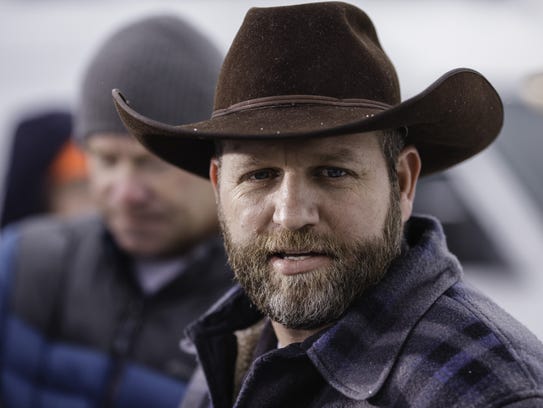 Ammon Bundy speaks at a news conference at the entrance