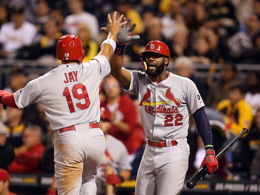 Cardinals rout Pirates, seal NL Central title and 100-win season