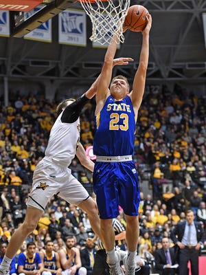 South Dakota State Jackrabbits guard Reed Tellinghuisen (23) drives in for a dunk against Wichita State Shockers guard Austin Reaves (12) during the second half at Charles Koch Arena. Wichita State won 89-67. Mandatory Credit: Peter G. Aiken-USA TODAY Sports