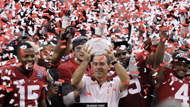 In this Jan. 9, 2012, file photo, Alabama head coach Nick Saban celebrates with his team after the national championship game against LSU, in New Orleans. The one constant in college football over the last 80 years has been the AP poll. It has helped link the past with the present and provided perspective.