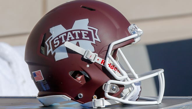 A Mississippi State helmet sits on an equipment case.