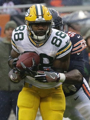 Green Bay Packers running back Ty Montgomery (88) makes a seven yard reception before being wrapped up by Chicago Bears inside linebacker Christian Jones (52) during the first quarter of their game Sunday, November 12, 2017 at Soldier Field in Chicago, Ill.