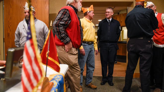 Mark Moots, national commander of the 40&8 veterans group, talks with people upon arriving at an event Friday, Jan. 27, at the American Legion Waite park Silver Star Post 428. The 40&8 is an independent, by invitation honor organization committed to charitable and patriotic programs. 