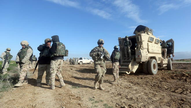 U.S. troops train Iraq's 72nd Brigade in a live-fire exercise in southeast Baghdad on Jan. 27, 2016. Today, about 3,600 U.S. troops remain in Iraq – now trying to rebuild its military so it can defeat the Islamic State.