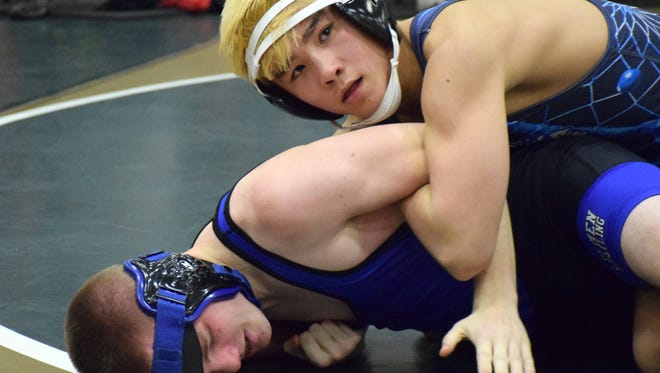 Fort Defiance's Lain Weaver, top, won the 126-pound championship at the Valley District Wrestling Tournament on Saturday at Turner Ashby H.S. in Bridgewater.