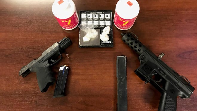 Two people were charged after guns, ammunition and cocaine were recovered Tuesday from a house at the 1700 block of MacArthur Avenue in Rockford.