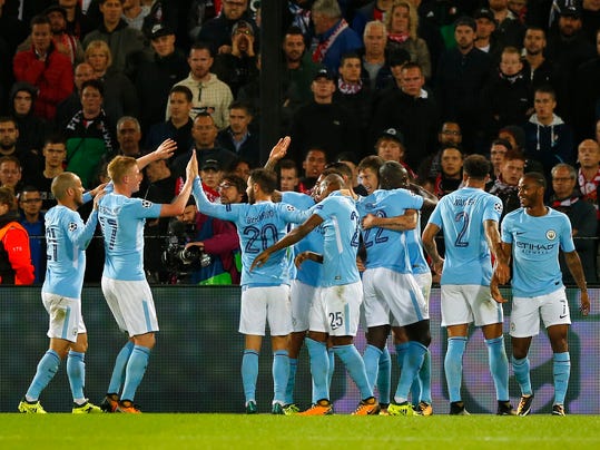 Manchester City's Kevin De Bruyne, second left, celebrates with other teammates after assisting in a fourth goal during a Champions League Group F soccer match between Feyenoord and Manchester City at the Kuip stadium in Rotterdam, Netherlands, Wednesday, Sept. 13, 2017. (AP Photo/Peter Dejong)