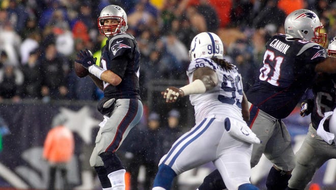 Jan. 18, 2015; Foxborough, Mass.; New England Patriots quarterback Tom Brady (12) drops back to pass against the Indianapolis Colts in the AFC Championship Game at Gillette Stadium.