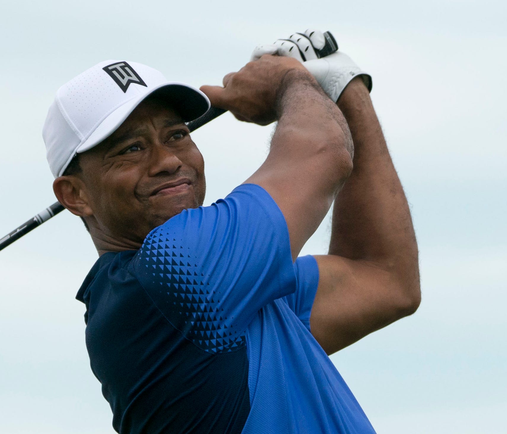 Tiger Woods hits his tee shot during Monday's practice round of the Hero World Challenge.