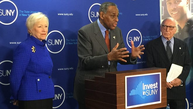 SUNY chairman Carl McCall speaks alongside Chancellor Nancy Zimpher in 2015 at an event near the state Capitol. SUNY is seeking more state aid and the authority to raise tuition.