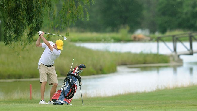 A golfer plays at Rolling Meadows Golf Course.
