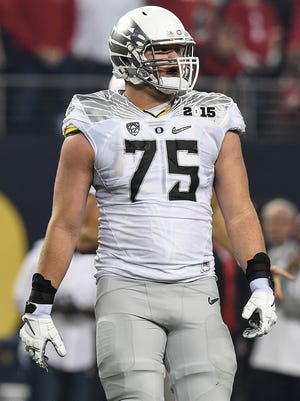 Oregon Ducks offensive lineman Jake Fisher stands on field against Ohio State.