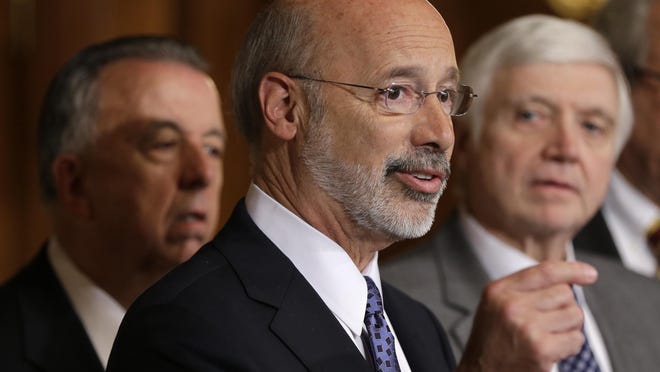 FILE - In this Oct. 7, 2015, file photo, Pennsylvania Gov. Tom Wolf, center, accompanied by state House Minority Leader Rep. Frank Dermody, right, D-Allegheny, and state Rep. Joe Markosek, left, D-Allegheny, discuss state budget negotiations at the state Capitol in Harrisburg, Pa. Pennsylvania's high court issued a new congressional district map for the state's 2018 elections on its self-imposed deadline Monday, Feb. 19, 2018, all but ensuring that Democratic prospects will improve in several seats and that Republican lawmakers challenge it in federal court. The map of Pennsylvania's 18 congressional districts is to be in effect for the May 15 primary and substantially overhauls a congressional map widely viewed as among the nation's most gerrymandered. The map was approved in a 4-3 decision. (AP Photo/Matt Rourke, File)