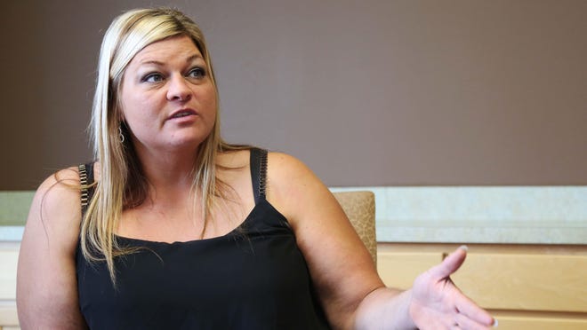 Danielle Rennenger, Indianola native, gives an interview on Thursday, Aug. 6, 2015 at the Newkirk Zwagerman law firm office in Des Moines after finding out she had won a law suit against her former employer, Toy Quest for sexual harassment. The jury awarded nearly $12 million to Rennenger.