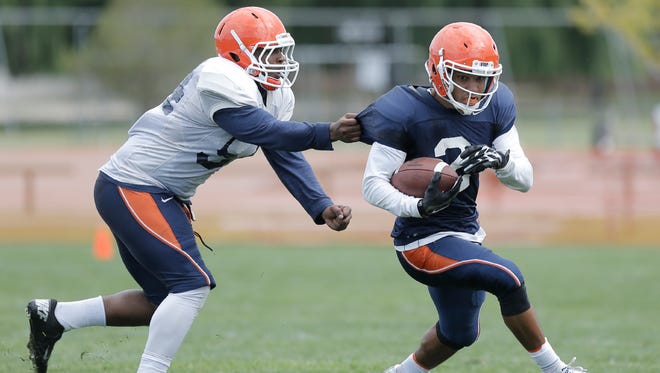 UTEP sophomore wide receiver Terry Juniel evades senior linebacker Silas Firstley during a recent practice at Camp Ruidoso.