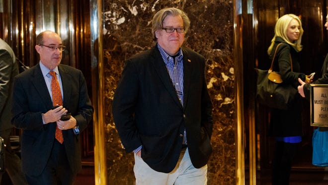 In this Friday, Nov. 11, 2016, file photo, Stephen Bannon, campaign CEO for President-elect Donald Trump, leaves Trump Tower in New York. Trump on Sunday named Republican Party chief Reince Priebus as White House chief of staff and conservative media owner Bannon as his top presidential strategist, two men who represent opposite ends of the unsettled GOP.