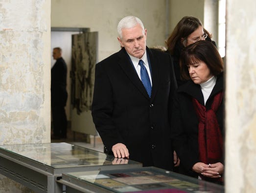 Pence and his wife, Karen, look at exhibit during a