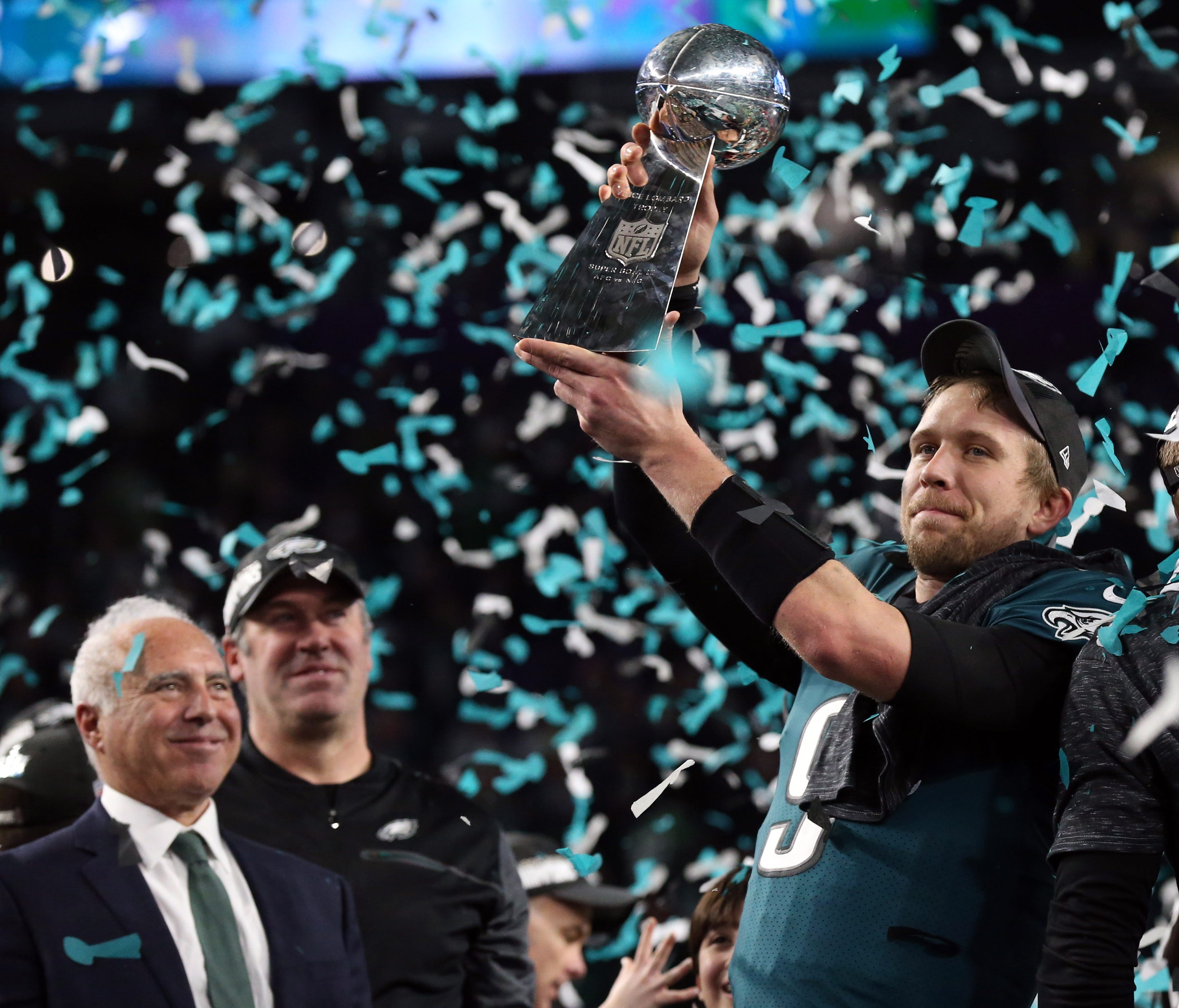 Philadelphia Eagles quarterback Nick Foles (9) celebrates with the Lombardi Trophy after defeating the New England Patriots 41-33 in Super Bowl LII at U.S. Bank Stadium.