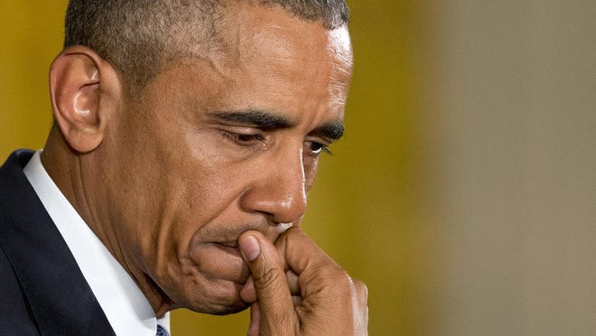 An emotional President Barack Obama pauses as he speaks about the youngest victims of the Sandy Hook shootings, Tuesday, Jan. 5, 2016, in the East Room of the White House in Washington, where he spoke about steps his administration is taking to reduce gun violence. (AP Photo/Jacquelyn Martin)