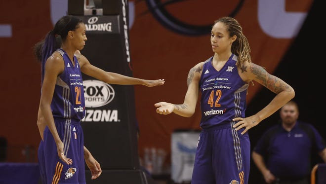 Mercury's DeWanna Bonner (24) and Brittney Griner (42) high-five during a game against the Dream at Talking Stick Resort Arena on September 11, 2016 in Phoenix, Ariz.
