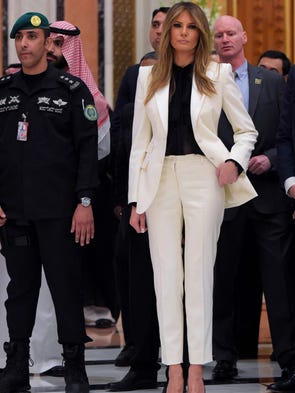First lady Melania Trump chose a white pants suit with