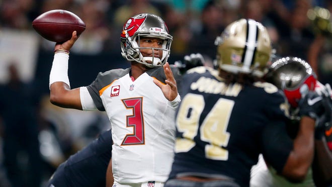 Tampa Bay Buccaneers quarterback Jameis Winston (3) passes under pressure from New Orleans Saints defensive end Cameron Jordan (94) in the first half of an NFL football game in New Orleans, Sunday, Nov. 5, 2017. (AP Photo/Butch Dill)