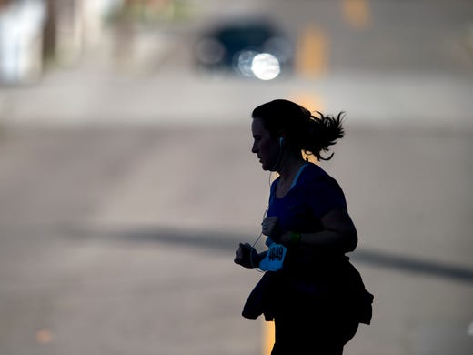A runner on Jackson Ave. during the Knoxville Marathon