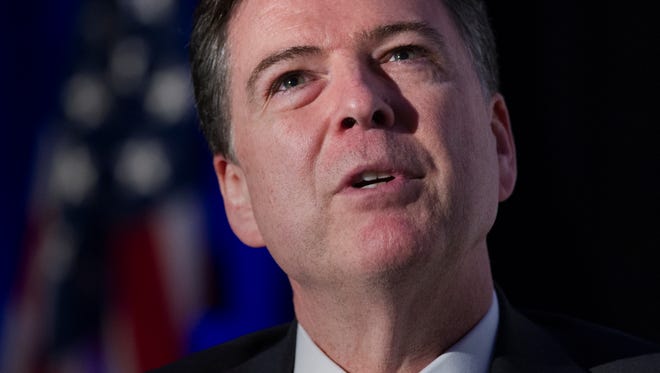 FILE - In this March 29, 2017, file photo, FBI Director James Comey speaks during the Intelligence and National Security Alliance Leadership Dinner in Alexandria, Va.  Aspiring federal agents who can hack a computer with ease but can’t shoot their way out of a paper bag could soon find a more welcoming FBI. (AP Photo/Cliff Owen, File)