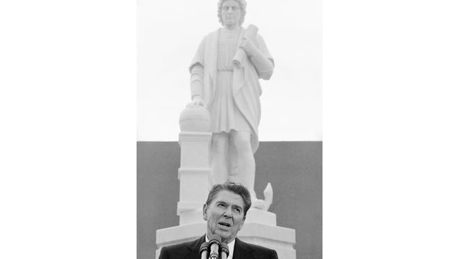 In this Monday, Oct. 9, 1984, file photo, President Ronald Reagan addresses a ceremony in Baltimore, to unveil a statue of Christopher Columbus. Baltimore protesters pulled down the statue of Christopher Columbus and threw it into the city's Inner Harbor, Saturday, July 4, 2020.