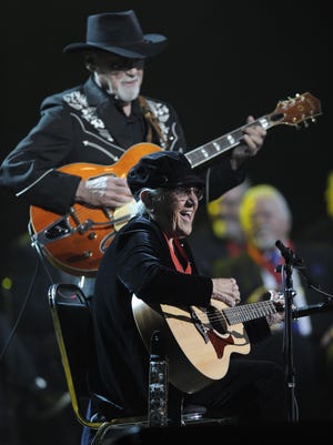 Duane Eddy and Corki Casey-O'Dell perform during a concert after being inducted into the Musicians Hall of Fame & Museum at the Municipal Auditorium on Tuesday Jan. 28, 2014 in Nashville, Tenn.