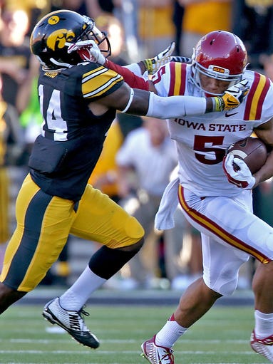 After the pass reception, Iowa State's #5 Allen Lazard, right, tried to fight off Iowa's #14 Desmond King in the fourth quarter in football game played at Kinnick Stadium in Iowa City on Saturday Sept. 13, 2014.