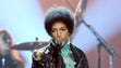 Prince performs onstage during the 2013 Billboard Music