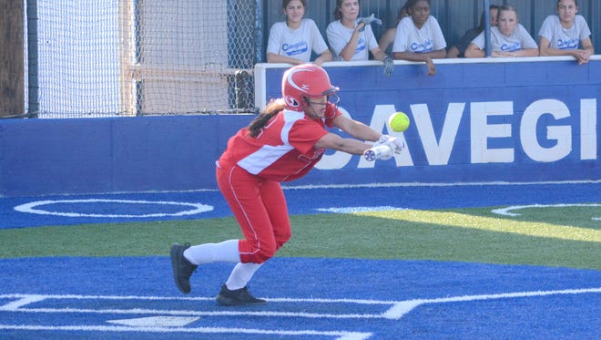 Loving's Alyssa Carrasco attempts a bunt in game one Monday at Carlsbad JV.