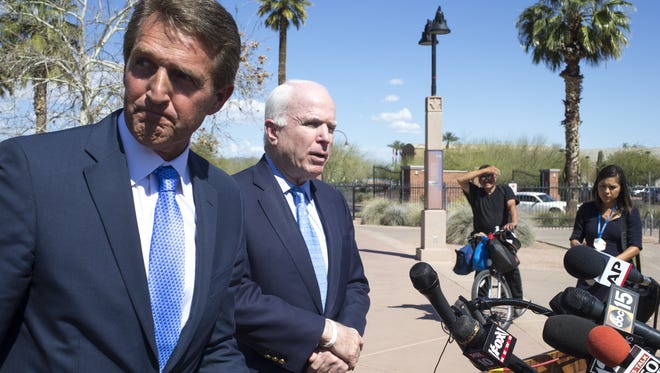 U.S. Sens. John McCain (right) and Jeff Flake.