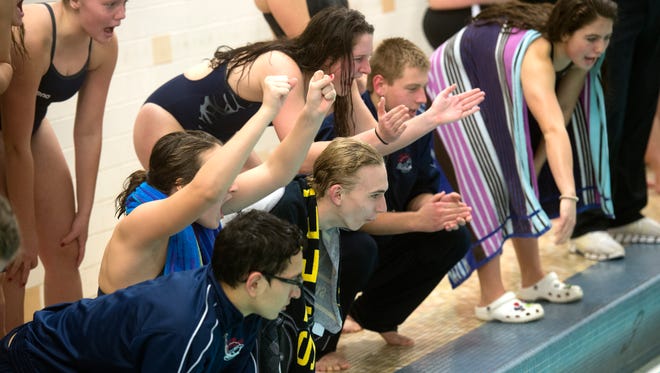 The South Western swim team cheers on swimmers, Thursday, Jan. 4, 2018. The South Western Mustangs beat the New Oxford Colonials, 121-59 for the boys; 104-79 for the girls. 