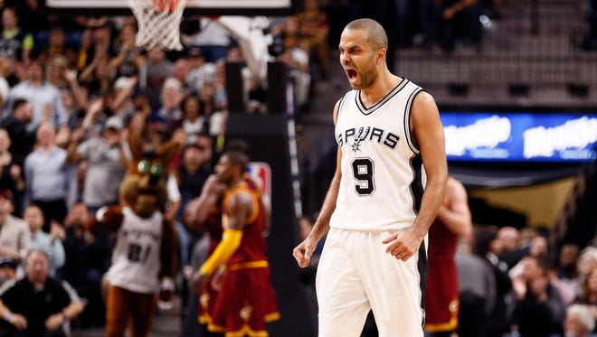 San Antonio Spurs point guard Tony Parker (9) reacts after a shot against the Cleveland Cavaliers during the second half at AT&T Center.
