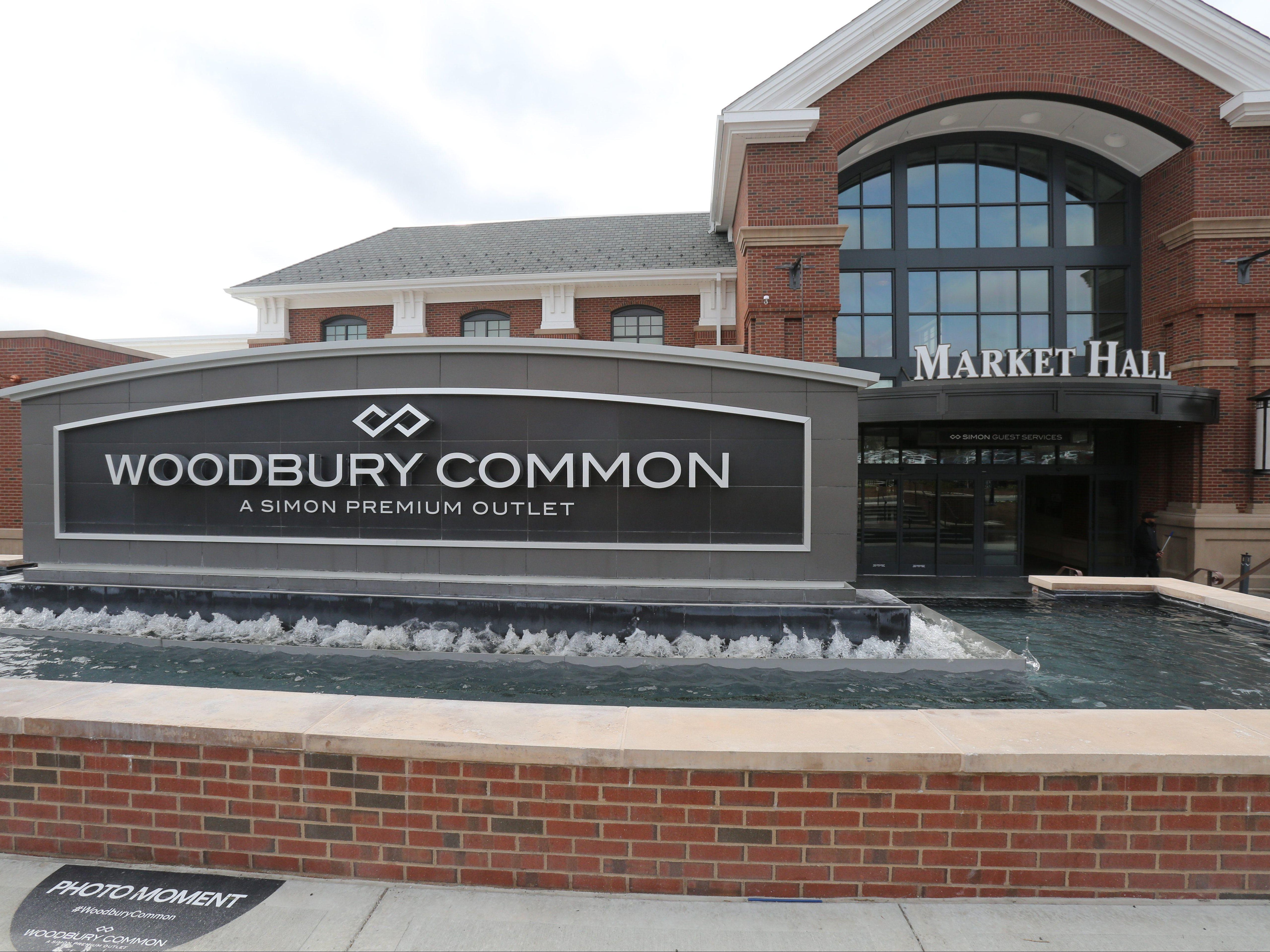 An entrance sign for Woodbury Common in Central Valley, April 19, 2017. Recent visitors to two stores there may have been exposed to measles.