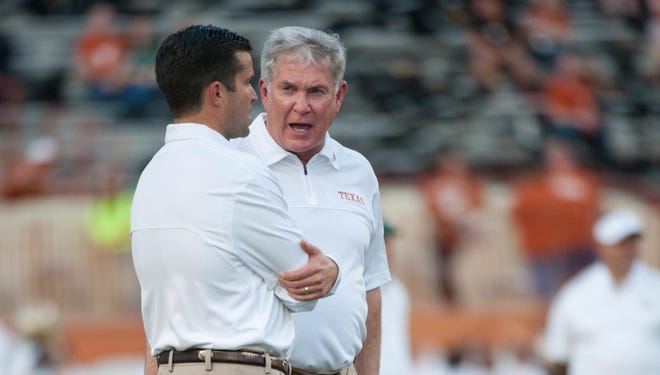 Mack Brown, right, fired defensive coordinator Manny Diaz after Texas gave up the most rushing yards in its history Saturday. Last year under the guidance of Diaz, the Longhorns surrendered the most points ever.