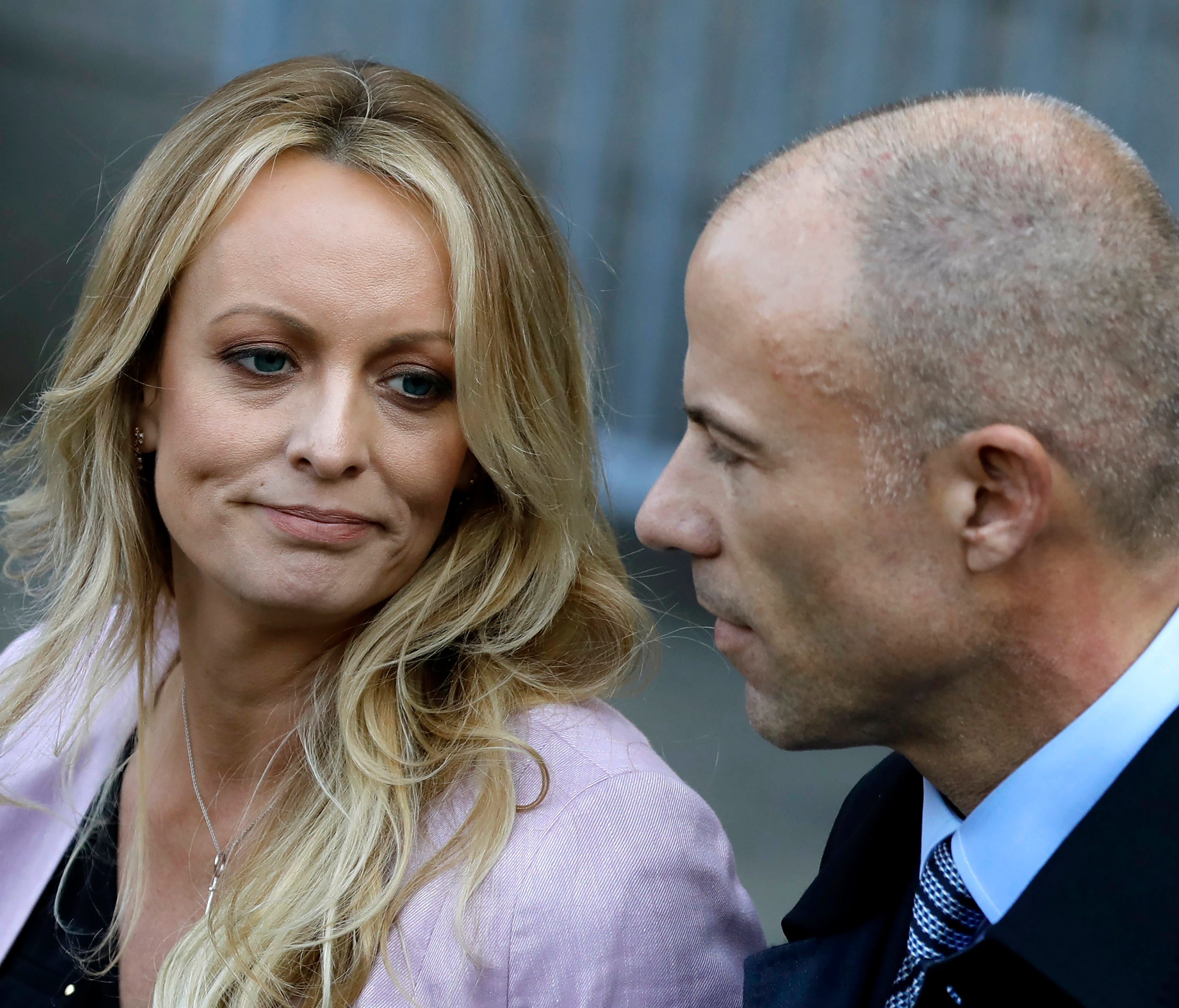 Stormy Daniels, also known as Stephanie Clifford, speaks to reporters with her attorney Michael Avenatti outside of federal court in New York City April 16.