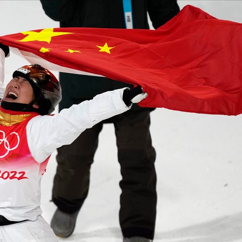 China's Xu Mengtao celebrates after winning a gold