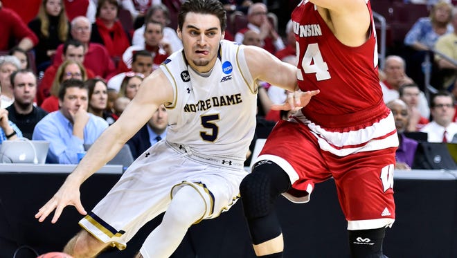 Former Point Beachs tandout Matt Farrell drives to the basket for Notre Dame Friday night in the East Regional semifinal against Wisconsin.