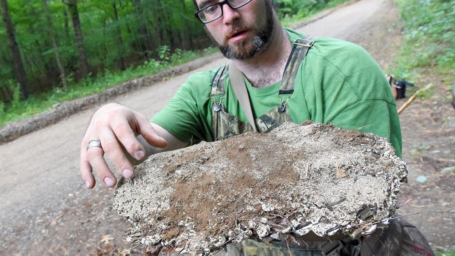 Bigfoot researcher Daniel Benoit of Crimora holds a cast of what he believes to be a Sasquatch footprint he found along Coal Road in Augusta over July 4th weekend. Founder of the East Coast Bigfoot Research Organization, Benoit is interviewed near the location the print was found near Stuarts Draft on Friday, July 10, 2015.