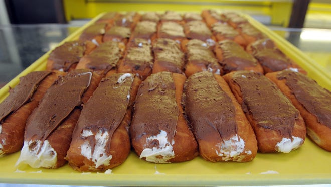 The chocolate-iced, cream-filled doughnuts are the most popular item at Donald's Donuts, located on Maple Avenue. Around 50 to 60 of the cream-filled donuts are made daily.